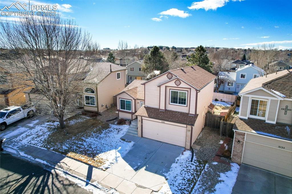 5145 Slickrock Drive Colorado Springs, CO 80923 - Photo 29 of 33 a front view of a house with a yard