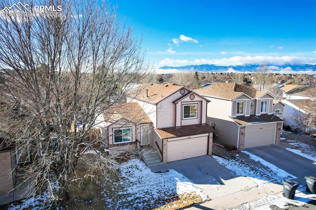 5145 Slickrock Drive Colorado Springs, CO 80923 - Photo 30 of 33 a view of a house with a yard
