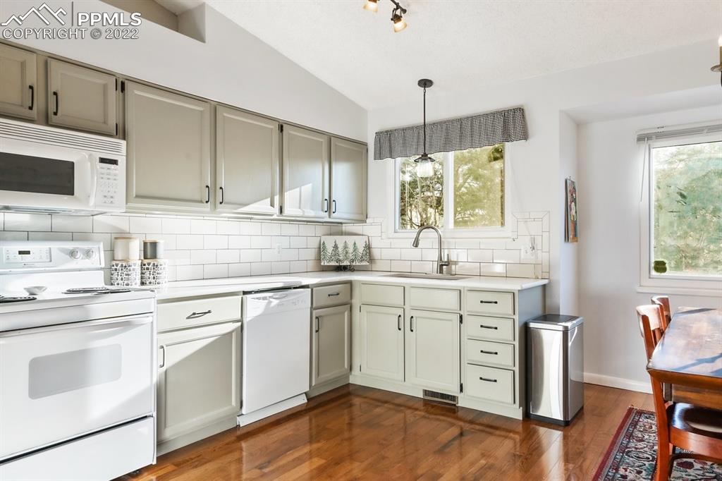 5145 Slickrock Drive Colorado Springs, CO 80923 - Photo 10 of 33 a kitchen with sink cabinets and window