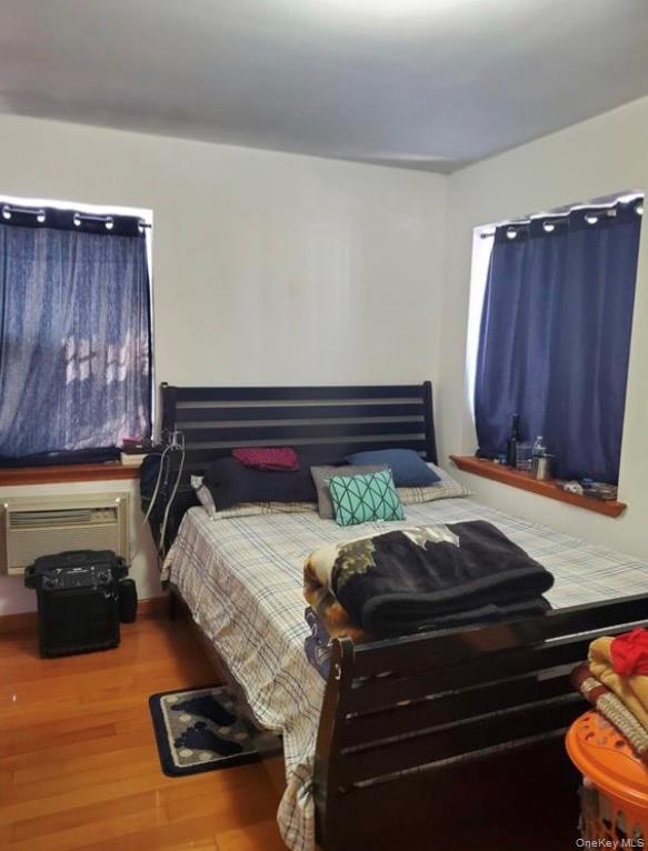 103-55 52nd Avenue Queens, NY 11368 - Photo 8 of 13 a bed sitting in a room next to a window
