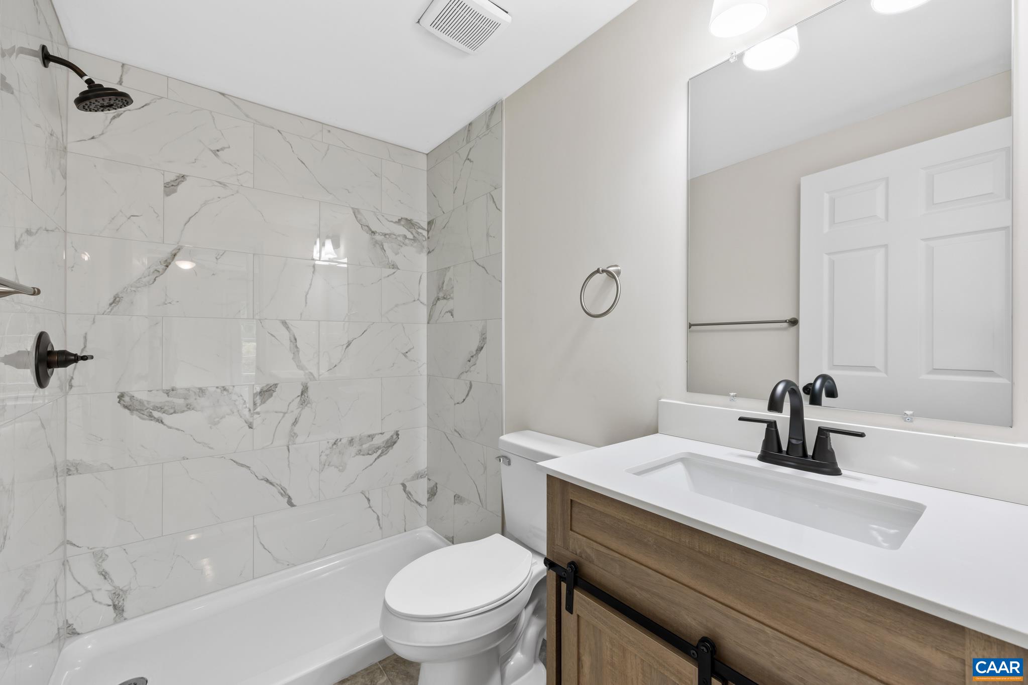 19 Harlow Town Road Louisa, VA 23093 - Photo 15 of 26 a bathroom with a sink a toilet and shower