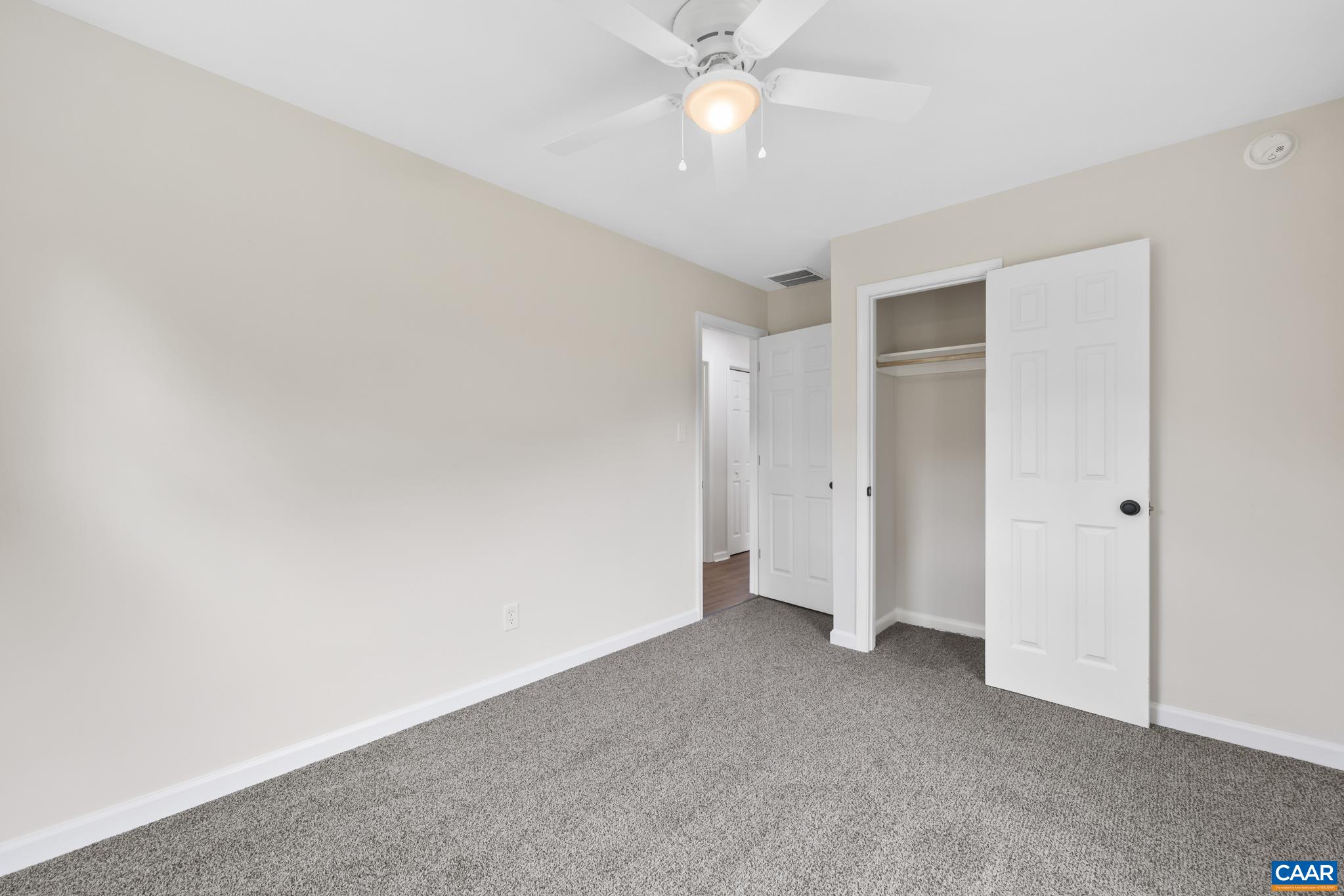 19 Harlow Town Road Louisa, VA 23093 - Photo 19 of 26 an empty room with a ceiling fan and a ceiling fan