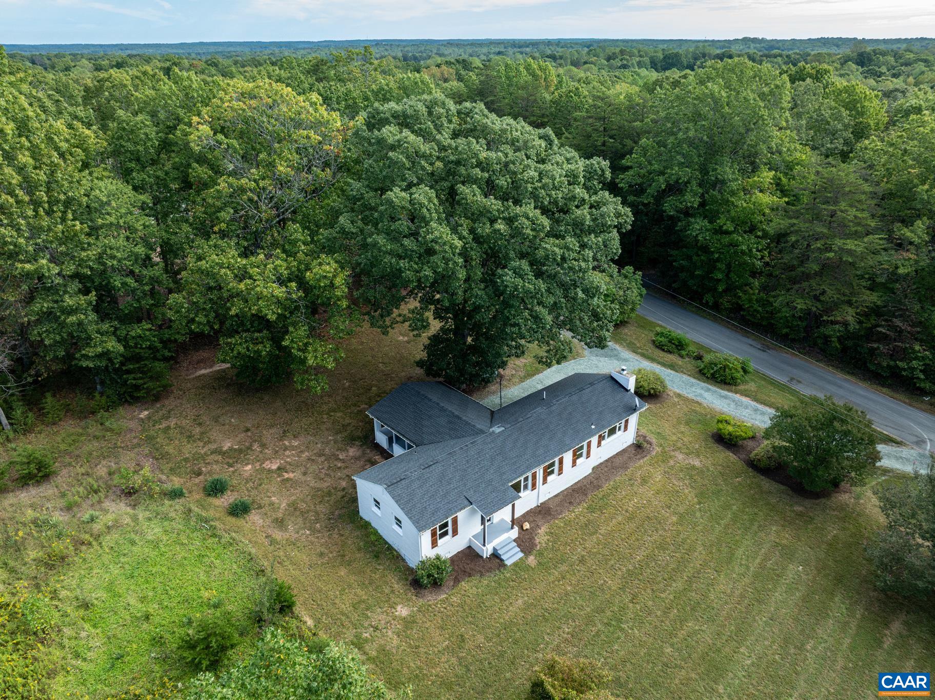 19 Harlow Town Road Louisa, VA 23093 - Photo 3 of 26 an aerial view of a house with a yard basket ball court and outdoor seating