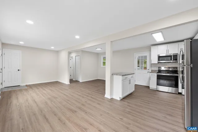 a view of kitchen with wooden floor