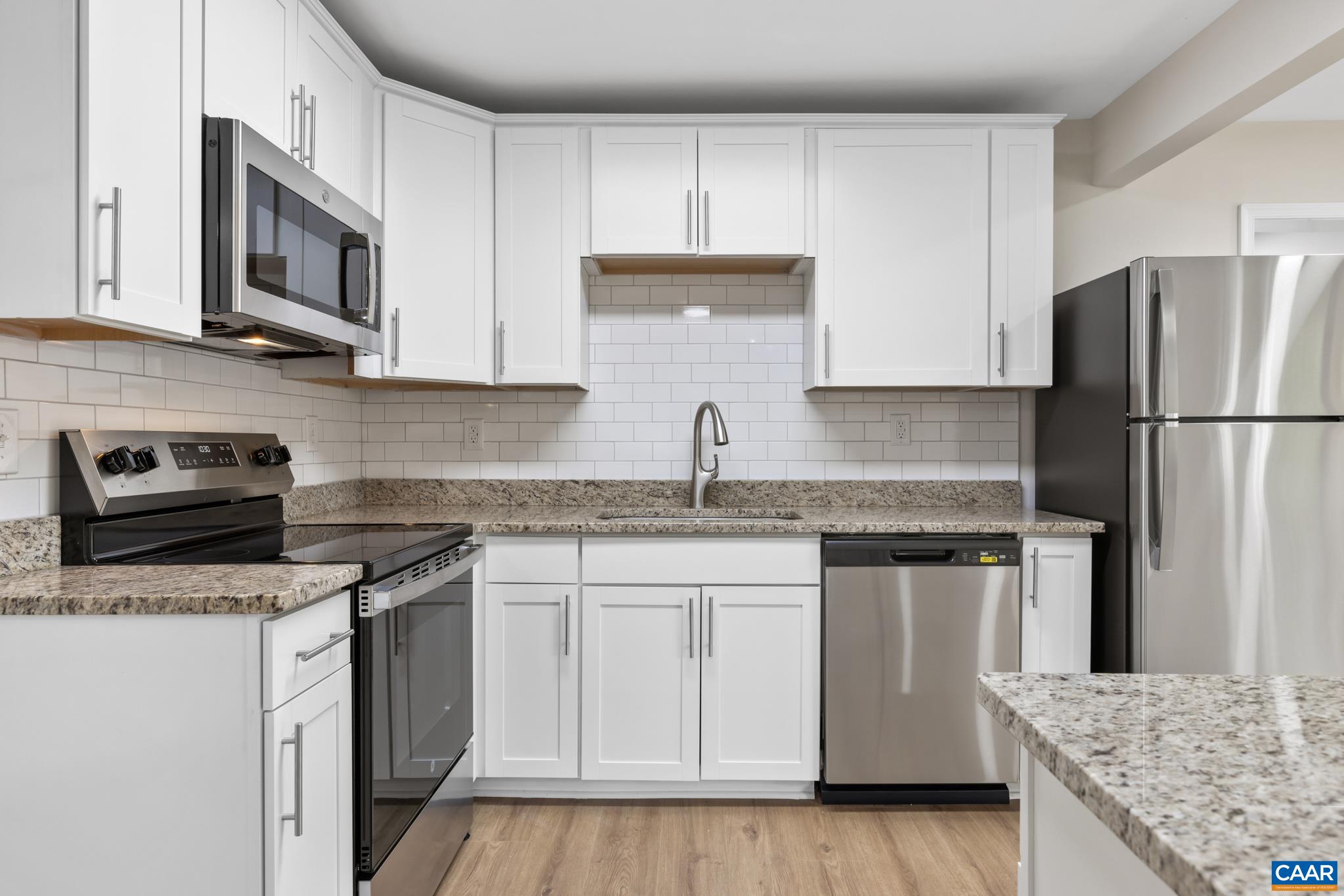 19 Harlow Town Road Louisa, VA 23093 - Photo 10 of 26 a kitchen with granite countertop a sink stove and refrigerator