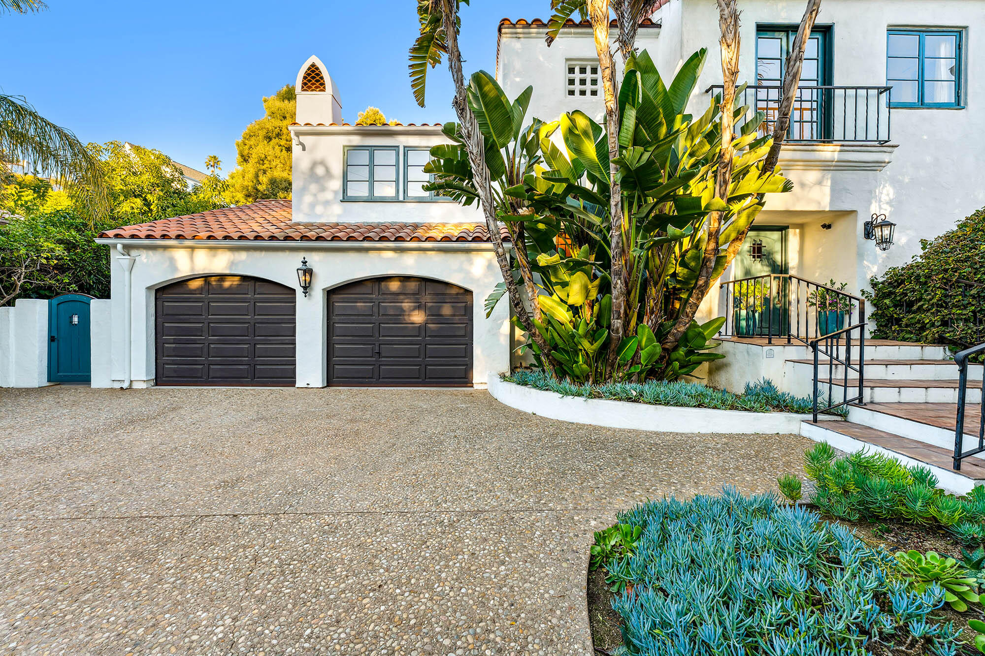 396 Las Alturas Road Santa Barbara, CA 93103 - Photo 12 of 70 a view of a house with a yard and potted plants