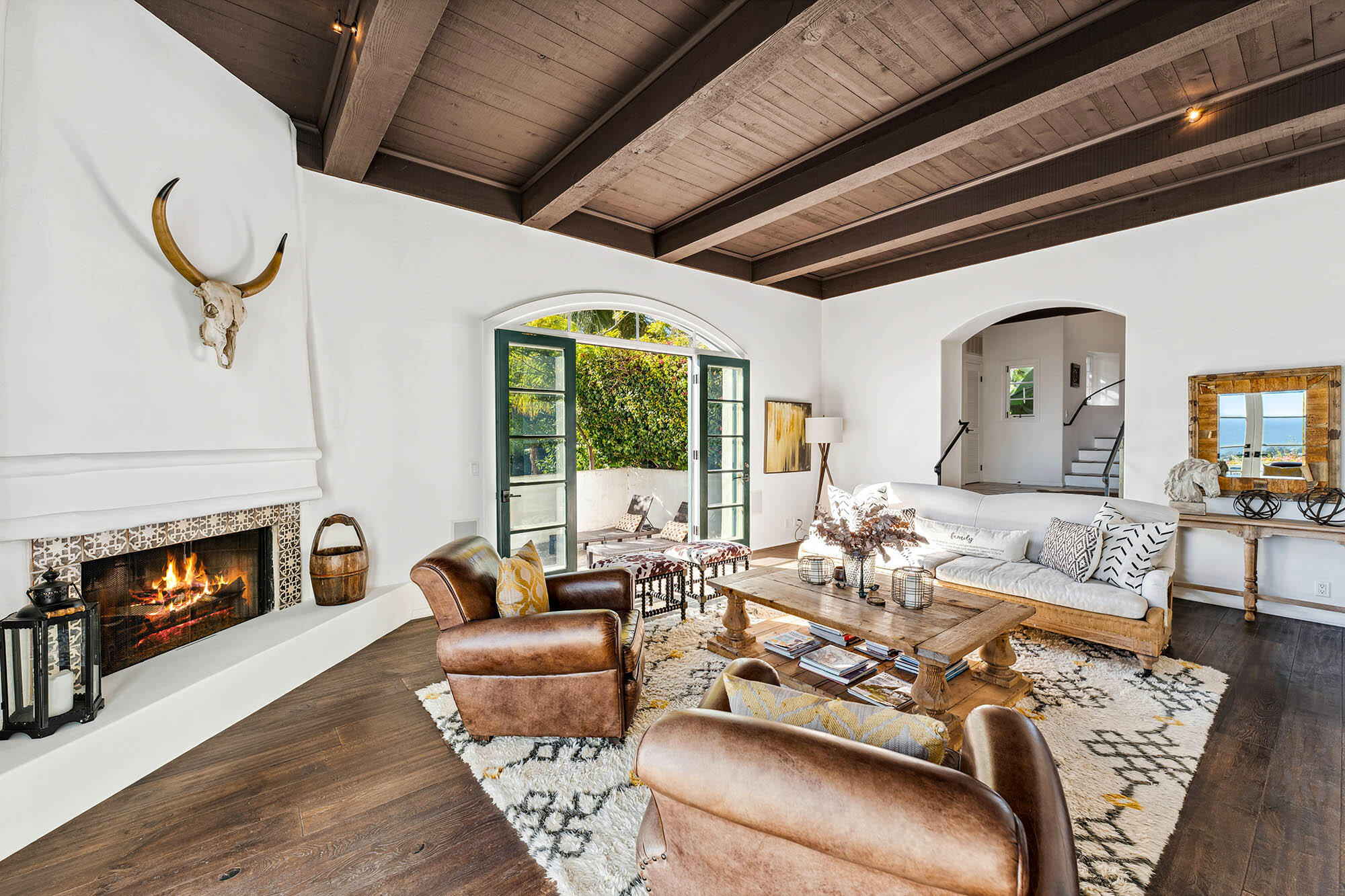 396 Las Alturas Road Santa Barbara, CA 93103 - Photo 16 of 70 a living room with furniture fireplace and a large window