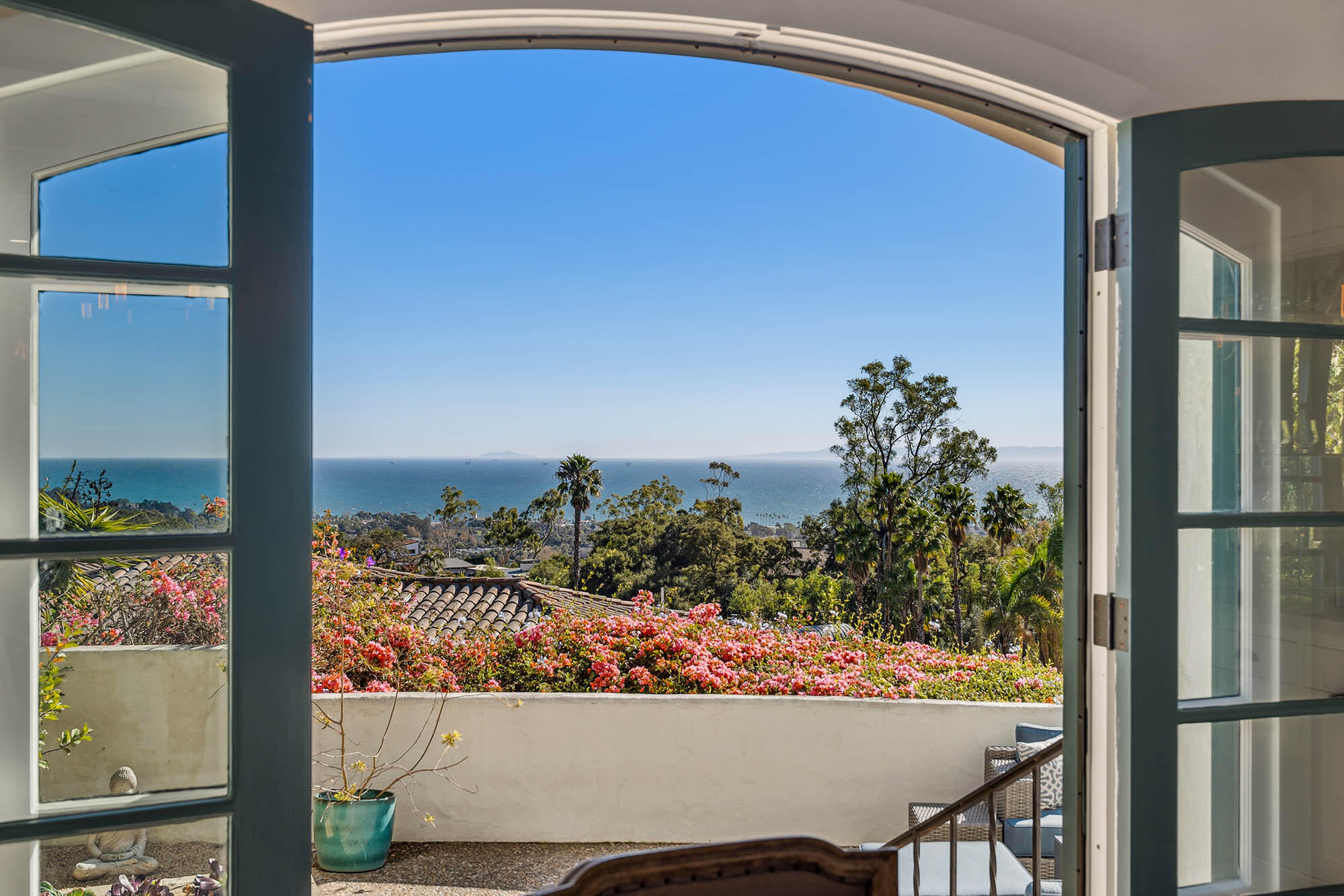 396 Las Alturas Road Santa Barbara, CA 93103 - Photo 21 of 70 a view of a balcony with chair and a potted plant
