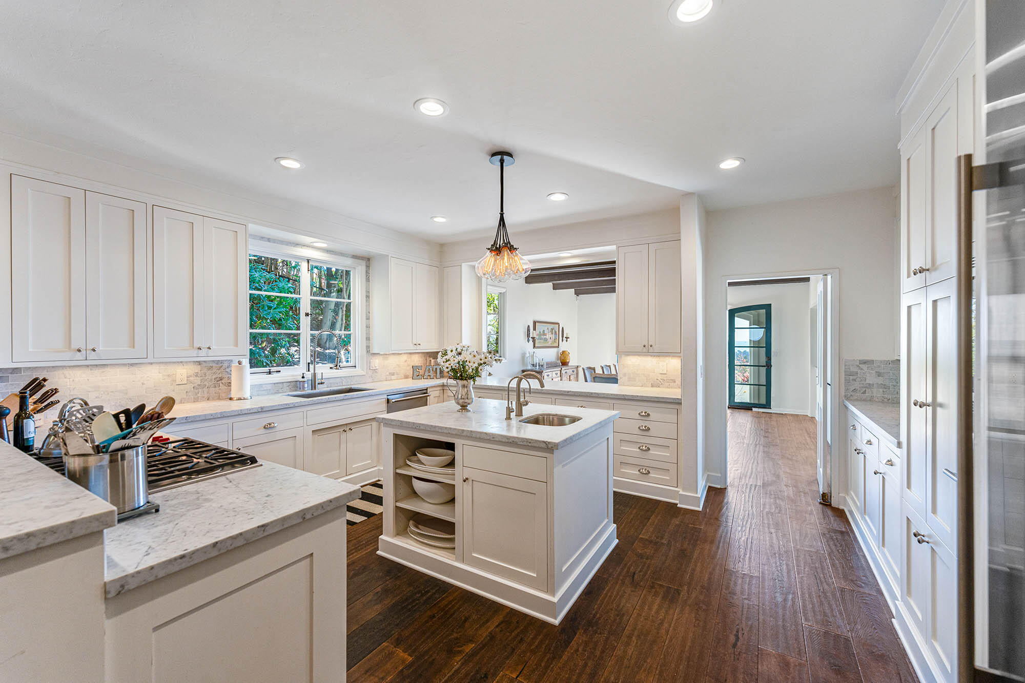 396 Las Alturas Road Santa Barbara, CA 93103 - Photo 24 of 70 a kitchen with a sink stove cabinets and wooden floor