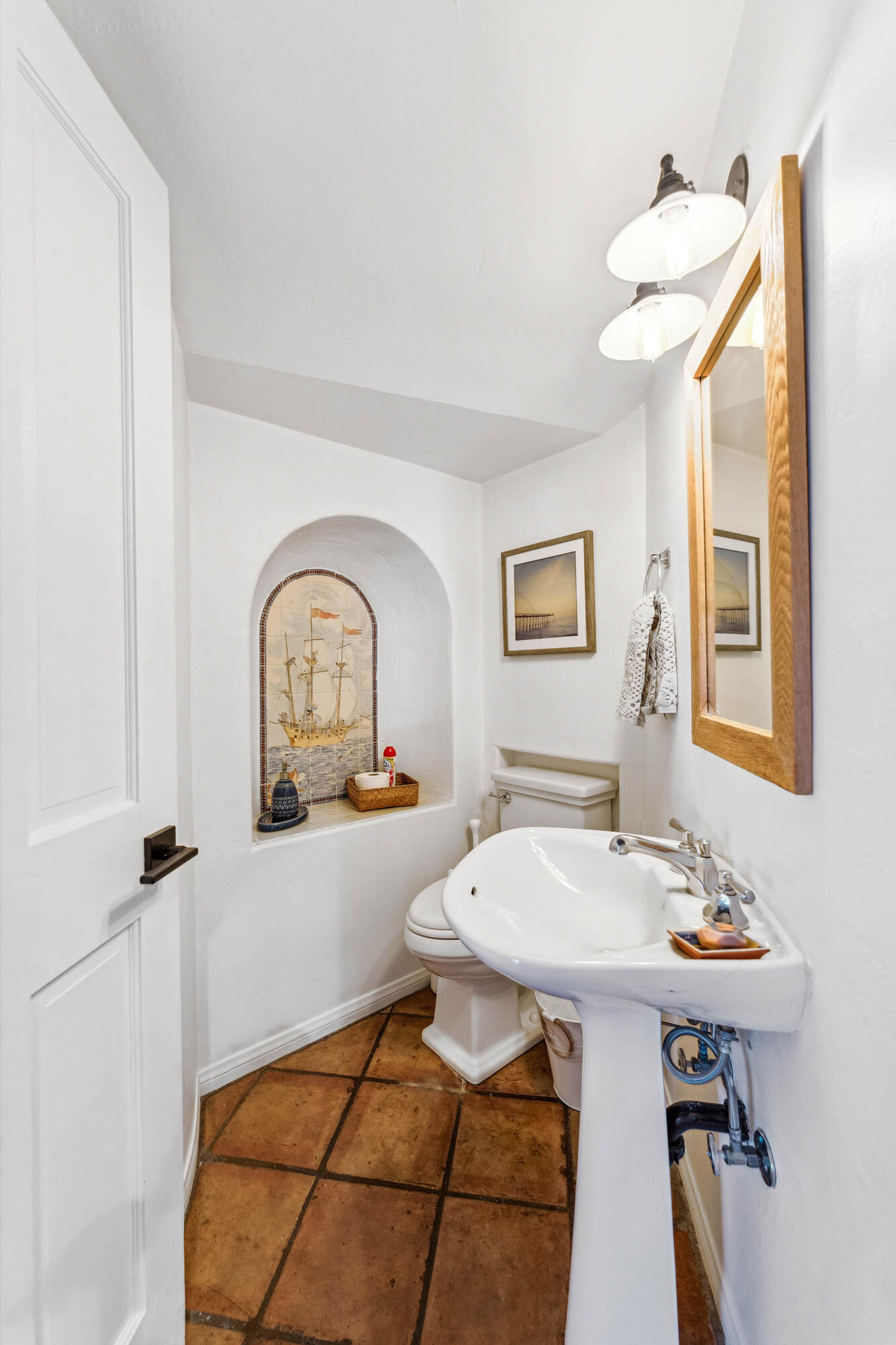 396 Las Alturas Road Santa Barbara, CA 93103 - Photo 27 of 70 a living room with a sink and a mirror