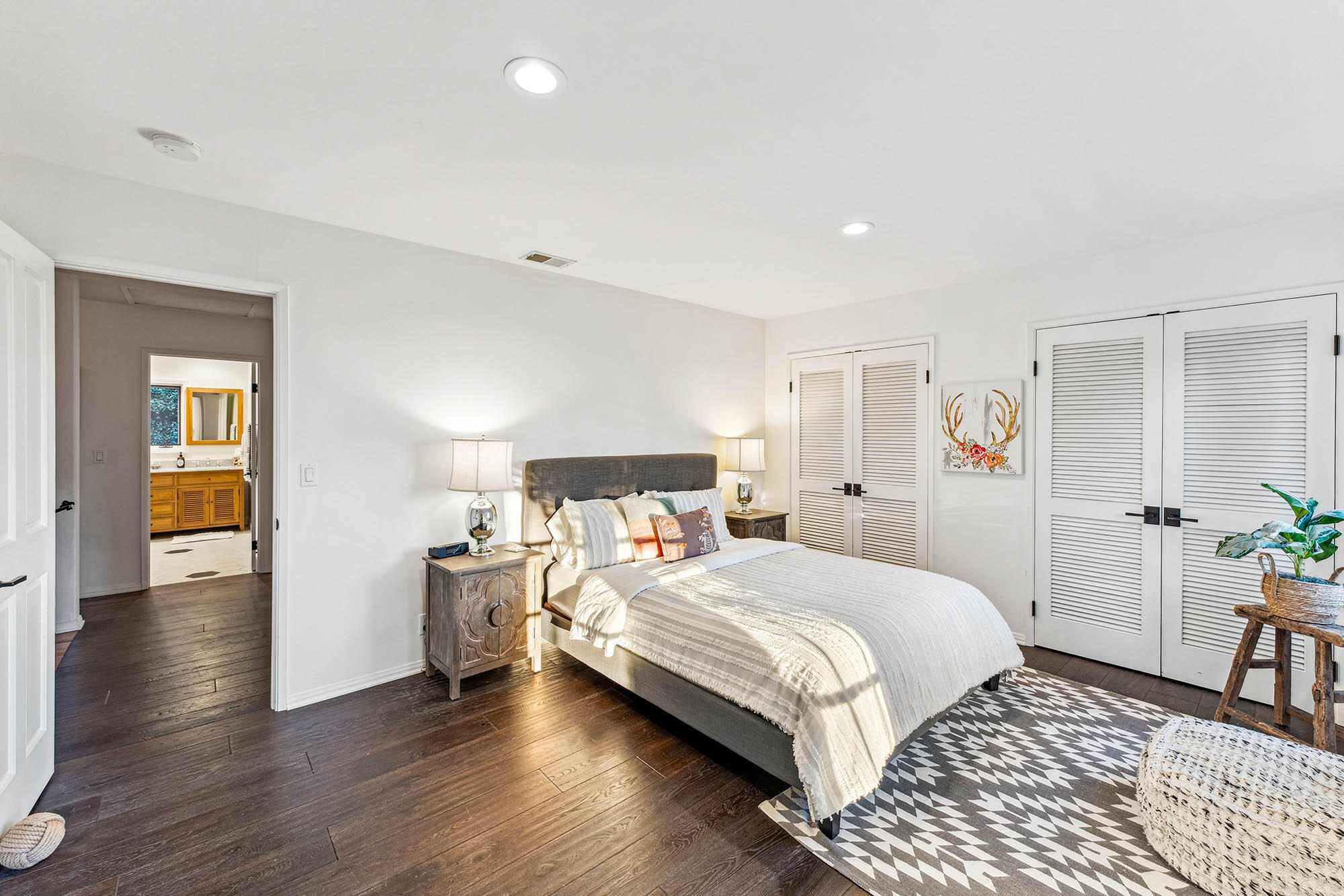 396 Las Alturas Road Santa Barbara, CA 93103 - Photo 36 of 70 a bedroom with a bed and wooden floor