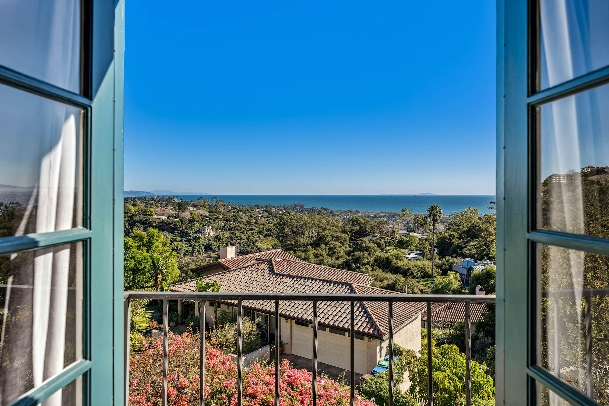 396 Las Alturas Road Santa Barbara, CA 93103 - Photo 40 of 70 a view of a balcony with chair and wooden floor