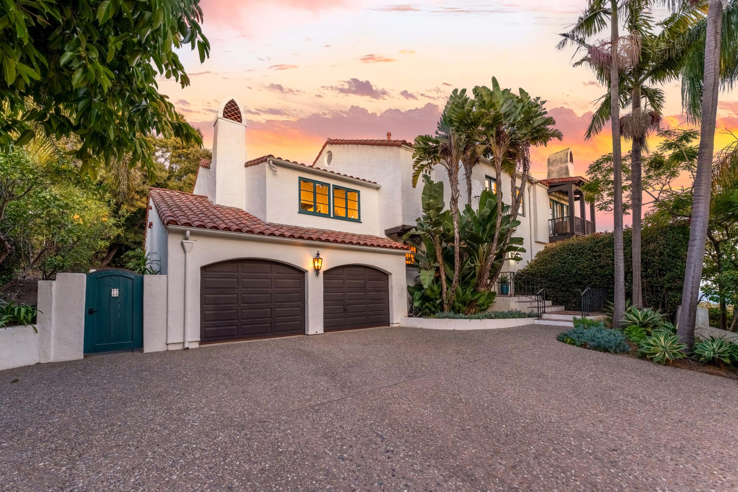 396 Las Alturas Road Santa Barbara, CA 93103 - Photo 58 of 70 a view of a house with a yard and palm trees