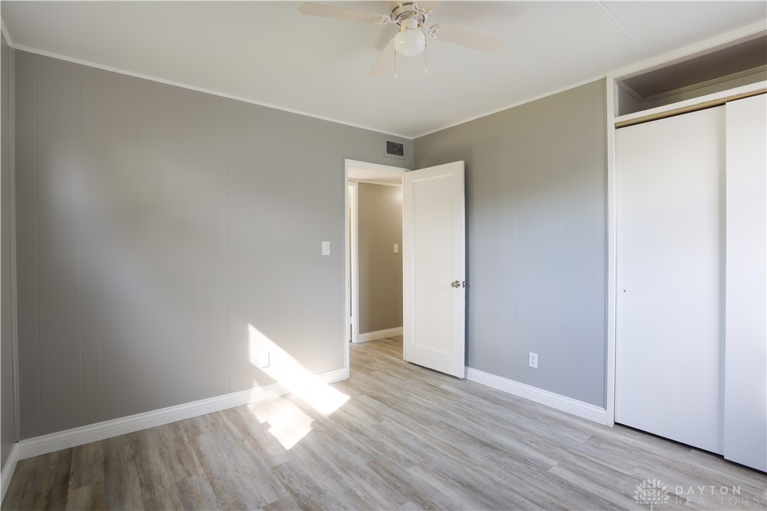 1627 Joselin Road Dayton, OH 45432 - Photo 21 of 28 This spacious bedroom offers ample natural light and a clean, modern aesthetic.