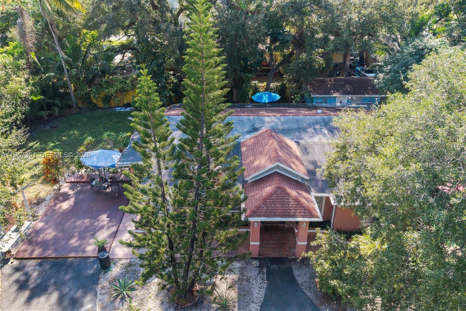 a aerial view of a house with a yard and garden