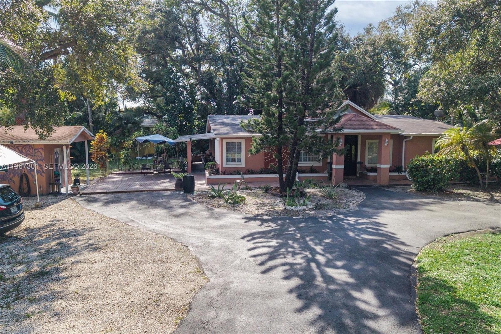 1760 Northeast 144th Street Miami, FL 33181 - Photo 2 of 83 a front view of a house with garden