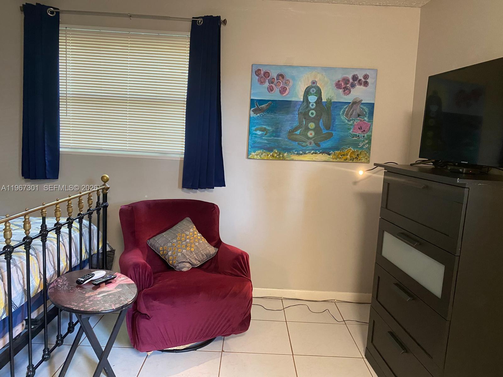 1760 Northeast 144th Street Miami, FL 33181 - Photo 29 of 83 a living room with furniture and a flat screen tv
