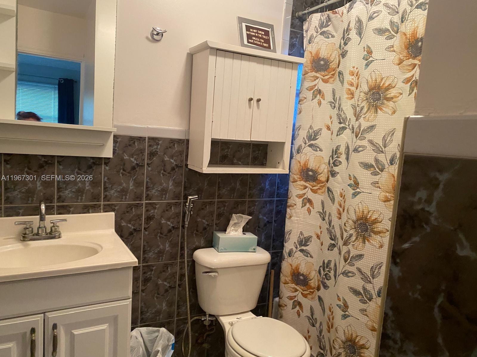 1760 Northeast 144th Street Miami, FL 33181 - Photo 30 of 83 a bathroom with a sink toilet and shower