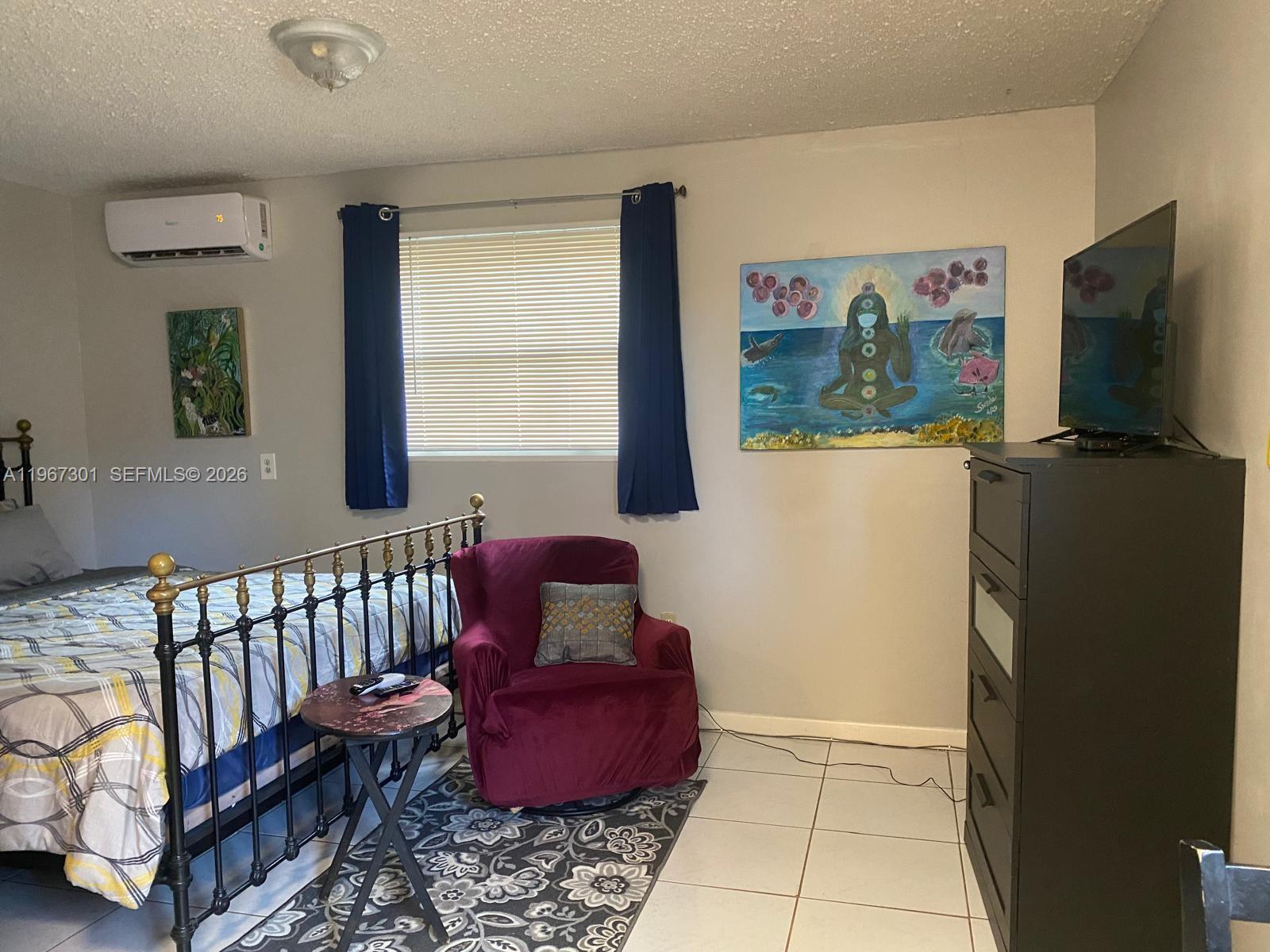 1760 Northeast 144th Street Miami, FL 33181 - Photo 33 of 83 a living room with furniture and a flat screen tv