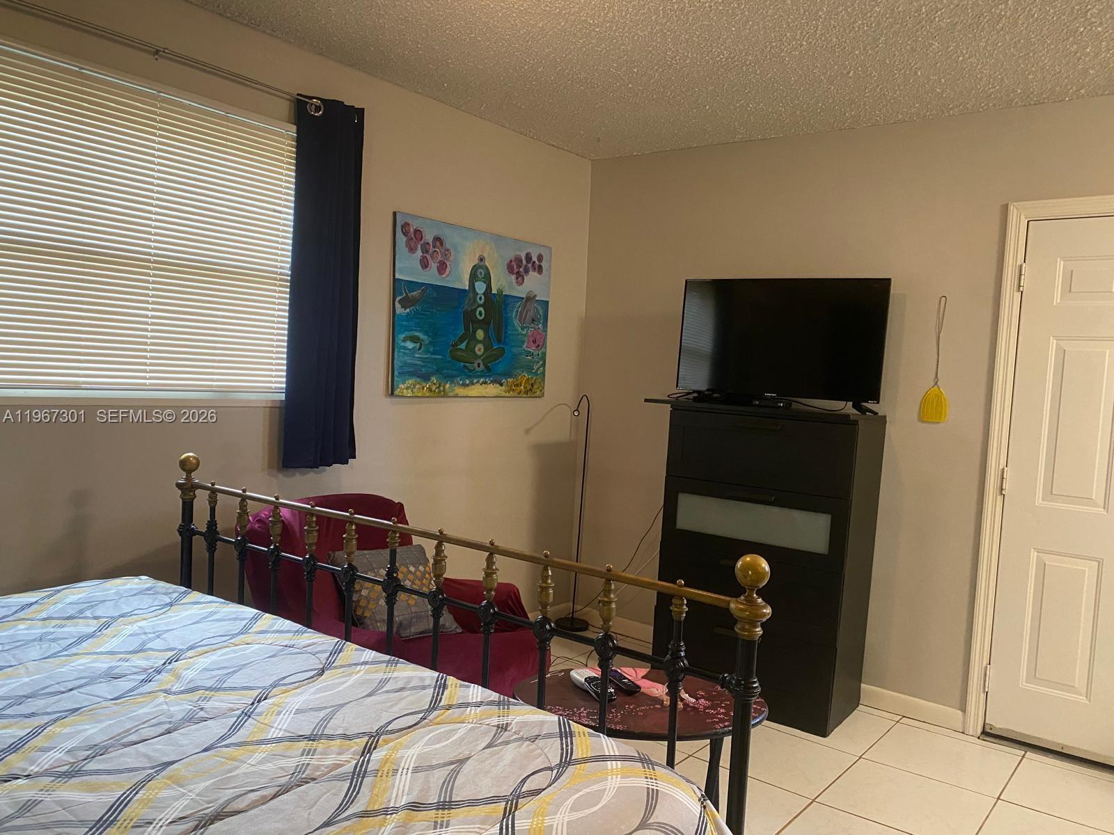 1760 Northeast 144th Street Miami, FL 33181 - Photo 36 of 83 a bedroom with a bed and furniture