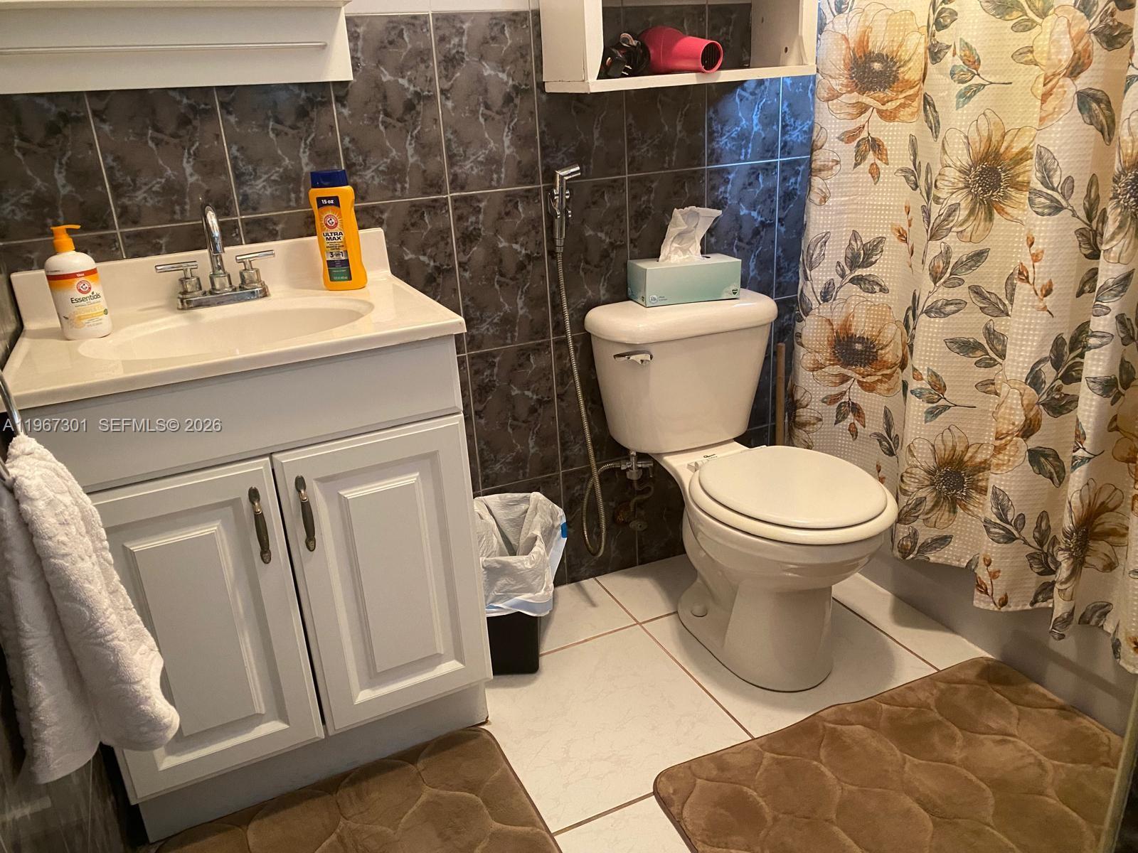 1760 Northeast 144th Street Miami, FL 33181 - Photo 37 of 83 a bathroom with a sink and a toilet