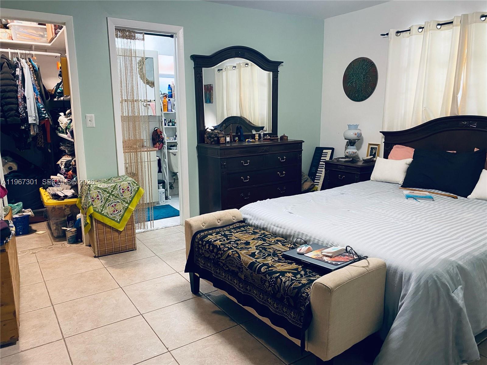 1760 Northeast 144th Street Miami, FL 33181 - Photo 56 of 83 a bedroom with a bed and dresser