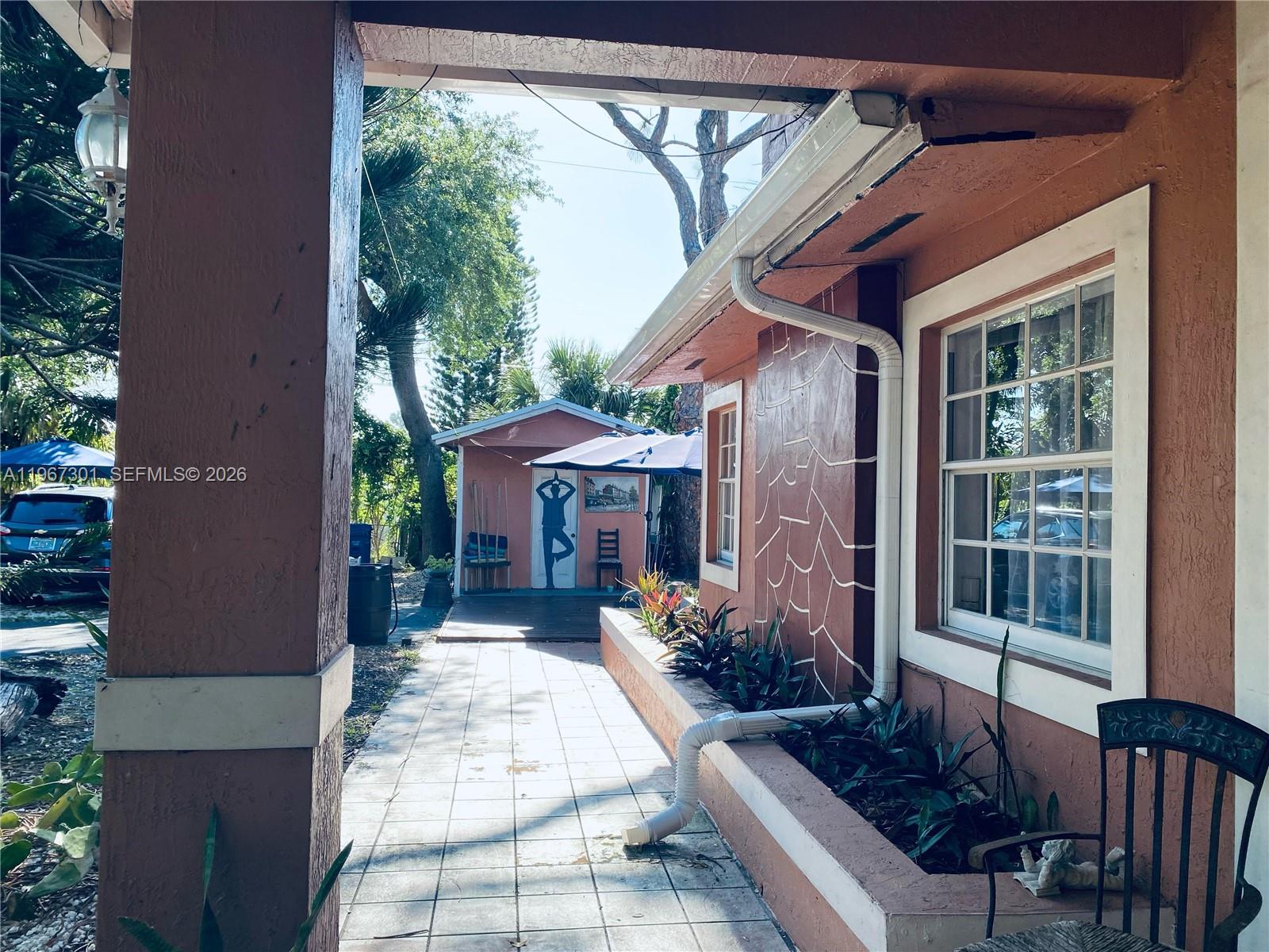 1760 Northeast 144th Street Miami, FL 33181 - Photo 60 of 83 a front view of a house with a porch