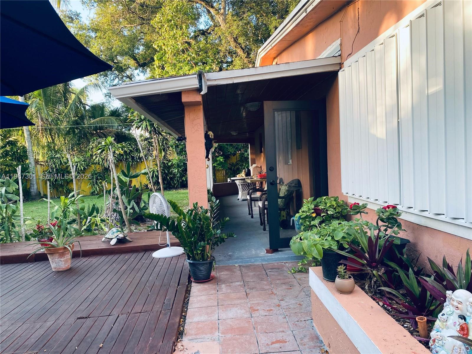 1760 Northeast 144th Street Miami, FL 33181 - Photo 75 of 83 a view of a house with porch and sitting area