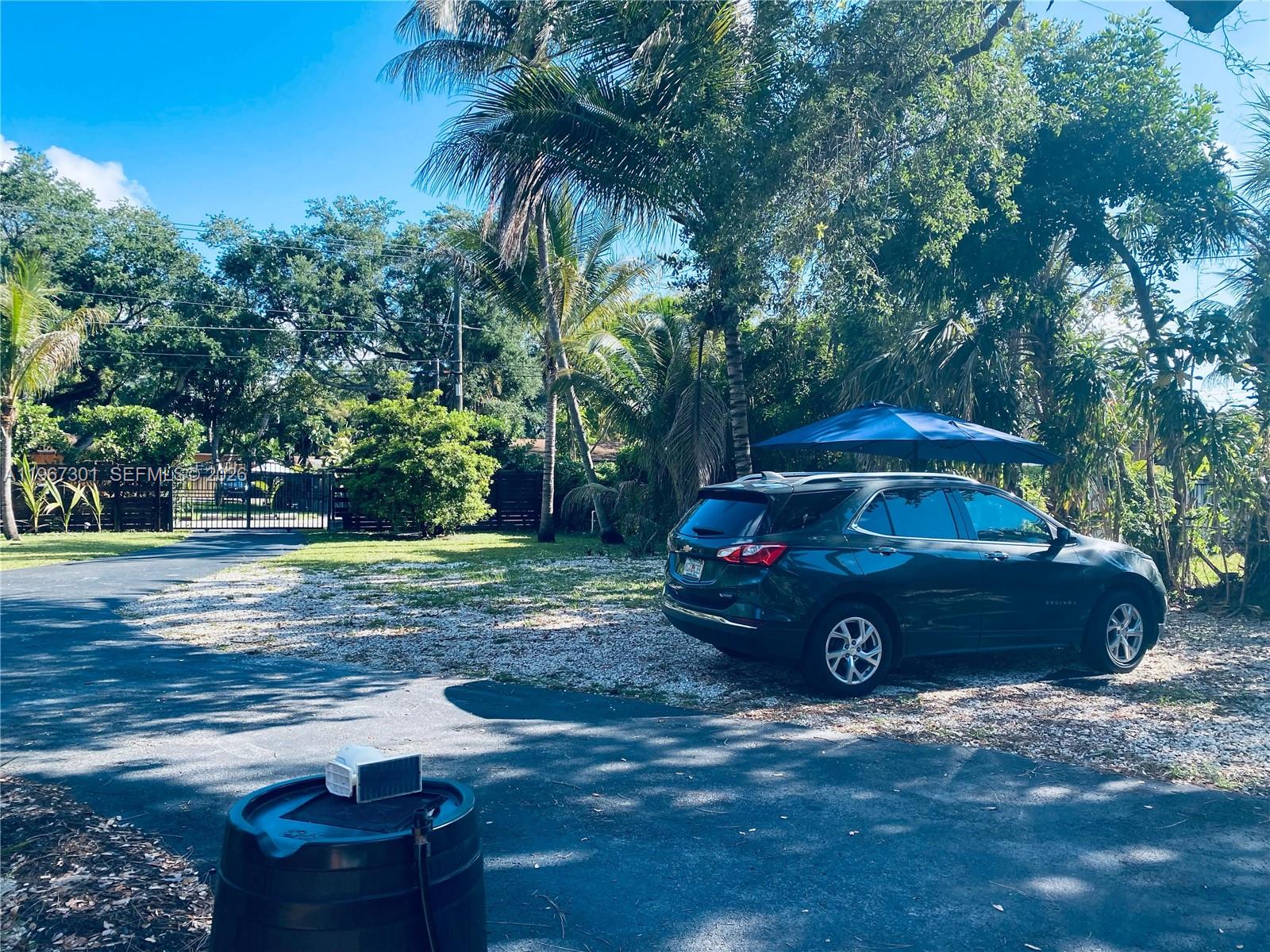 1760 Northeast 144th Street Miami, FL 33181 - Photo 79 of 83 a view of a car in front of a house