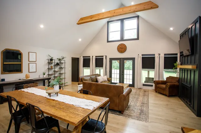 a view of a dining room with furniture window and wooden floor