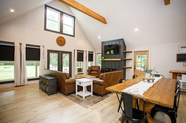 a view of a dining room with furniture window and wooden floor