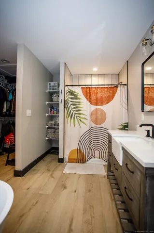 a bedroom with a bed and a walk in closet