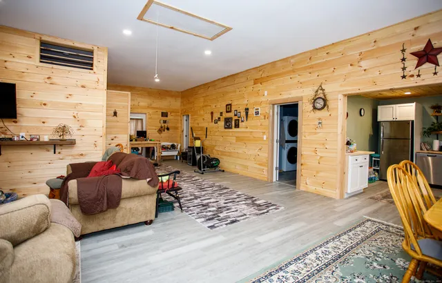 a living room with furniture and a rug