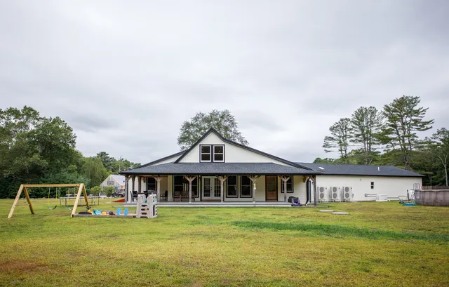 a front view of a house with garden