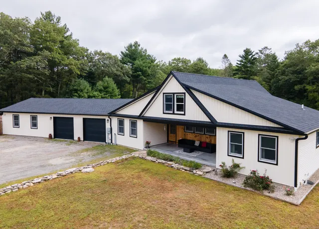 a house with trees in the background