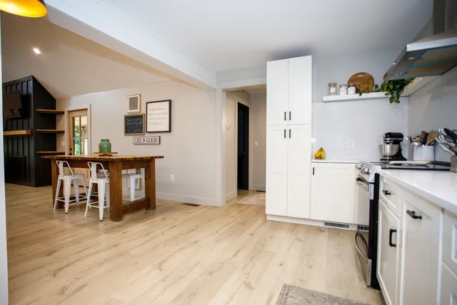 a view of kitchen with furniture and wooden floor