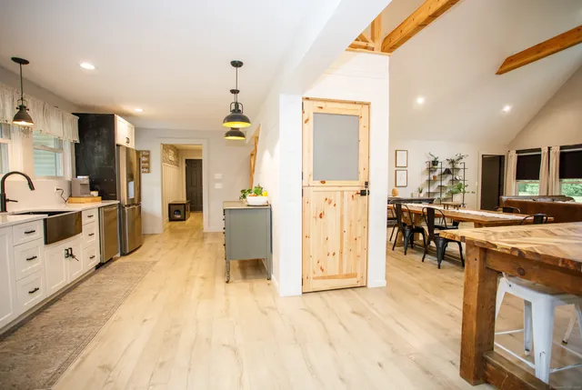 a large white kitchen with lots of counter space