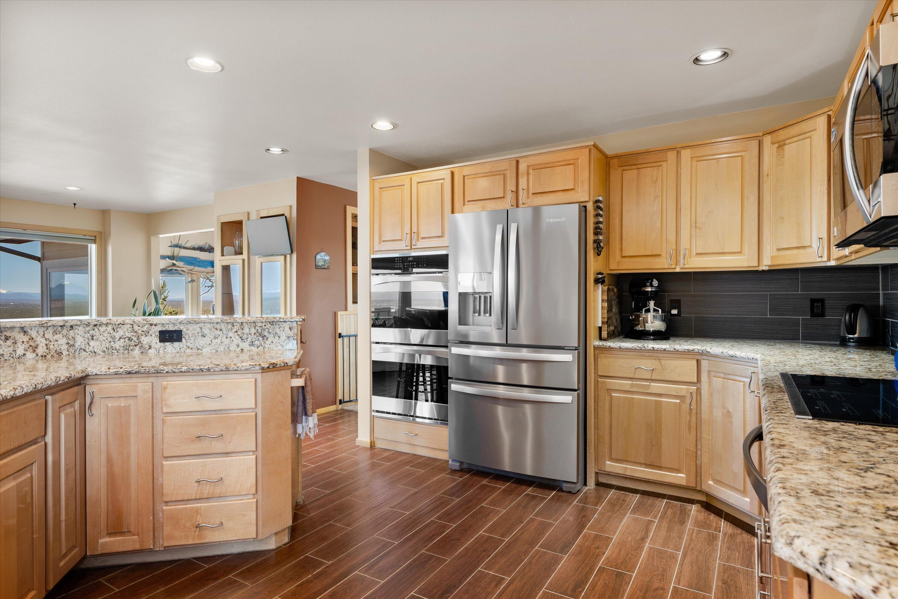 3124 Northwest Lynch Way Redmond, OR 97756 - Photo 12 of 89 Functional large kitchen with double ovens and induction cooktop