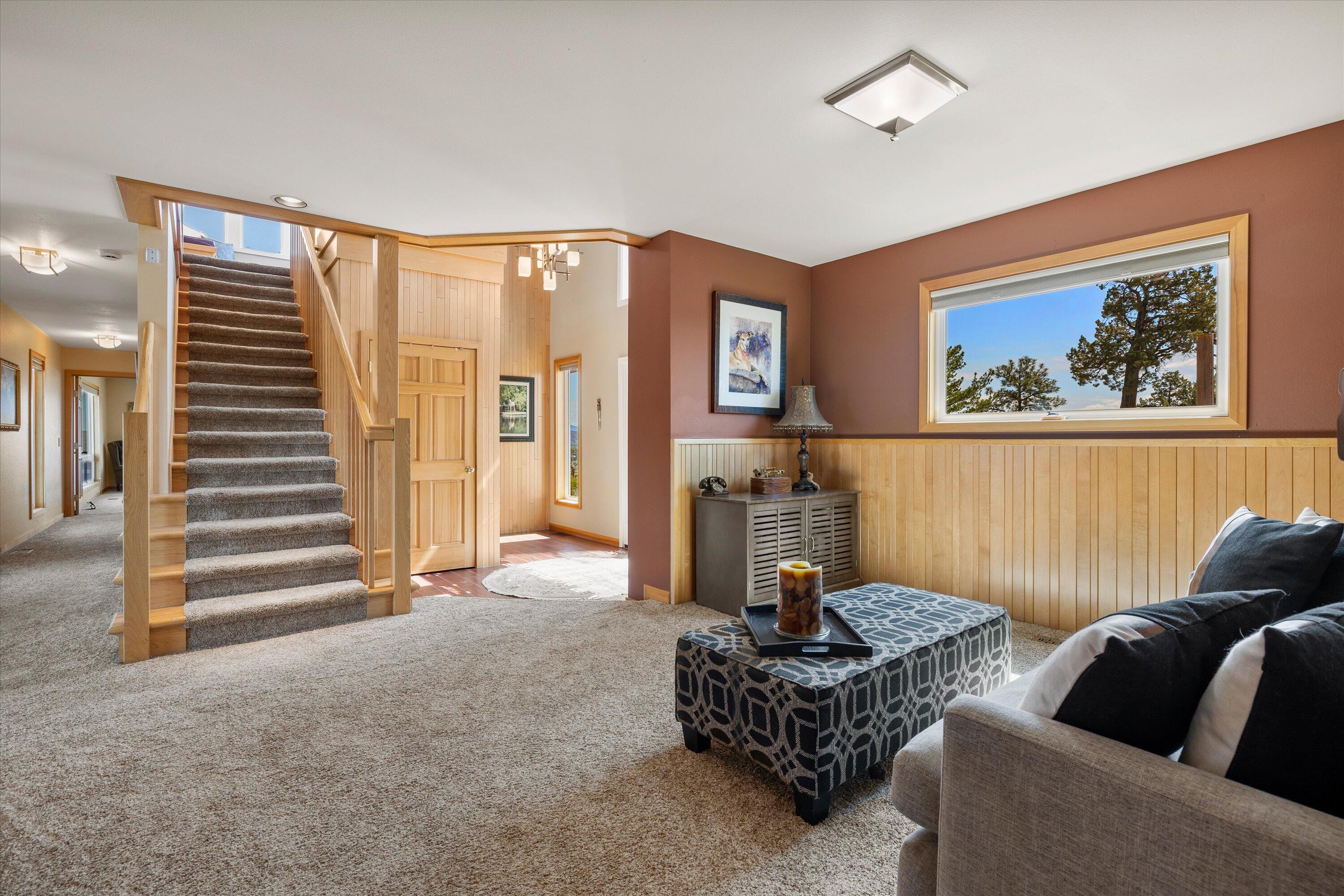 3124 Northwest Lynch Way Redmond, OR 97756 - Photo 33 of 89 Hall to suite two, stairs to Owner's suite