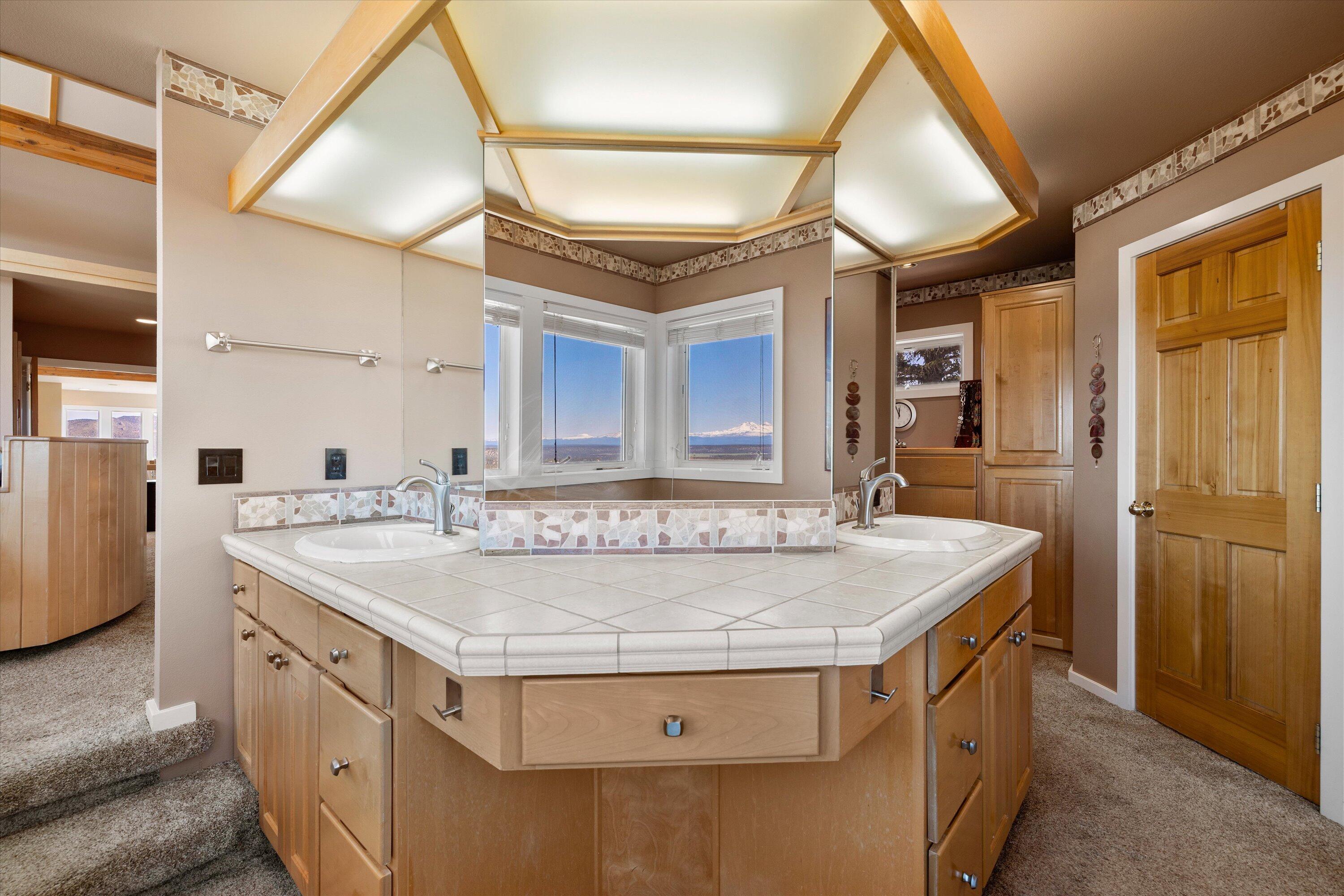 3124 Northwest Lynch Way Redmond, OR 97756 - Photo 50 of 89 Owner suite bath with mountain views in the mirror or out the window