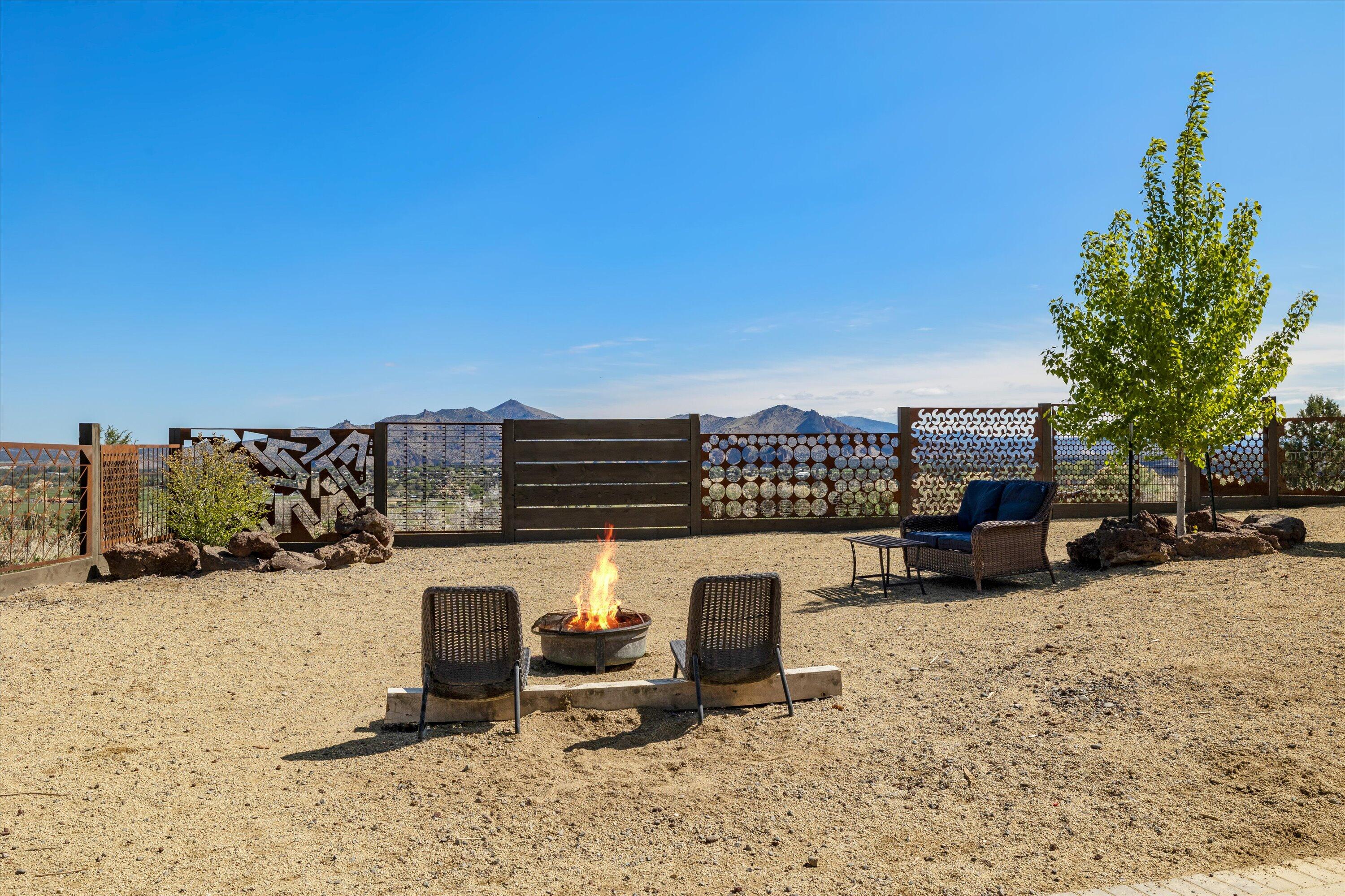 3124 Northwest Lynch Way Redmond, OR 97756 - Photo 68 of 89 Fenced yard and entrance to lower level suite three with Smith Rock views