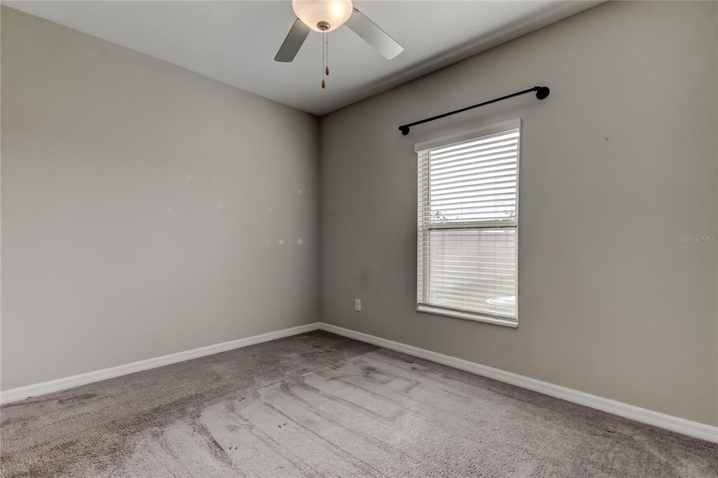 31592 Barrel Wave Way Wesley Chapel, FL 33545 - Photo 28 of 62 a view of an empty room with a window