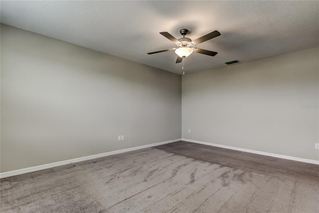 31592 Barrel Wave Way Wesley Chapel, FL 33545 - Photo 36 of 62 wooden floor in an empty room