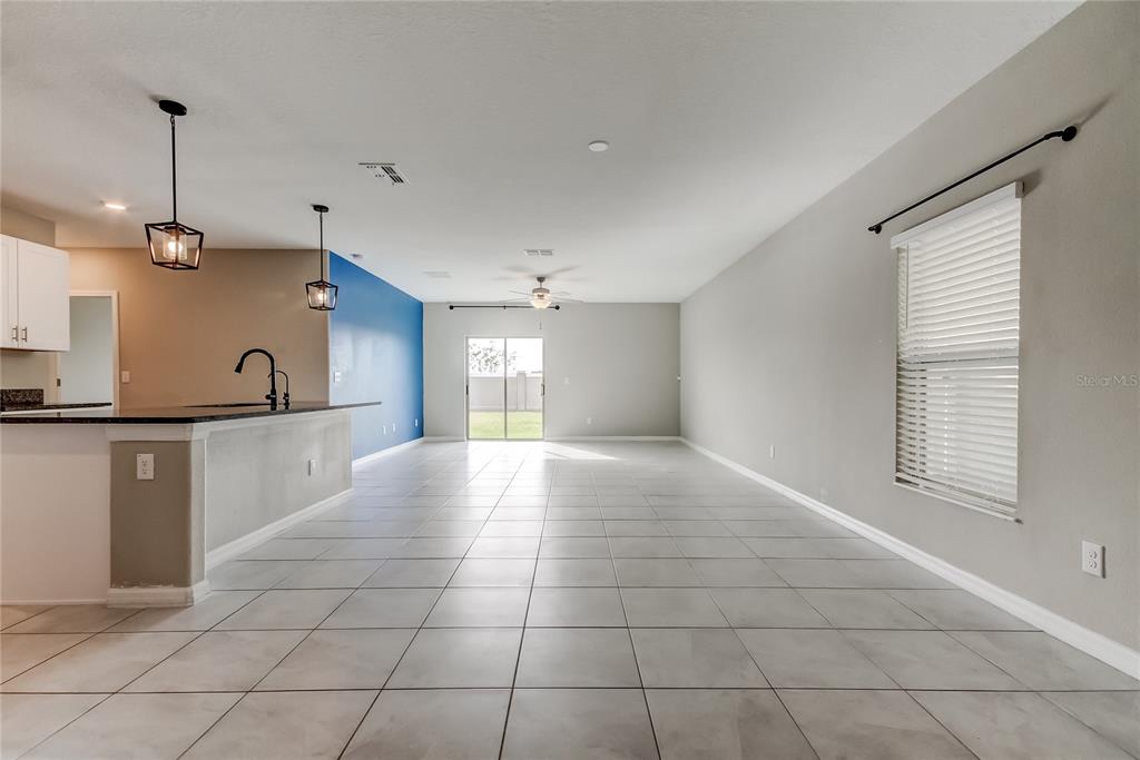 31592 Barrel Wave Way Wesley Chapel, FL 33545 - Photo 4 of 62 a view of a kitchen with a sink and a window