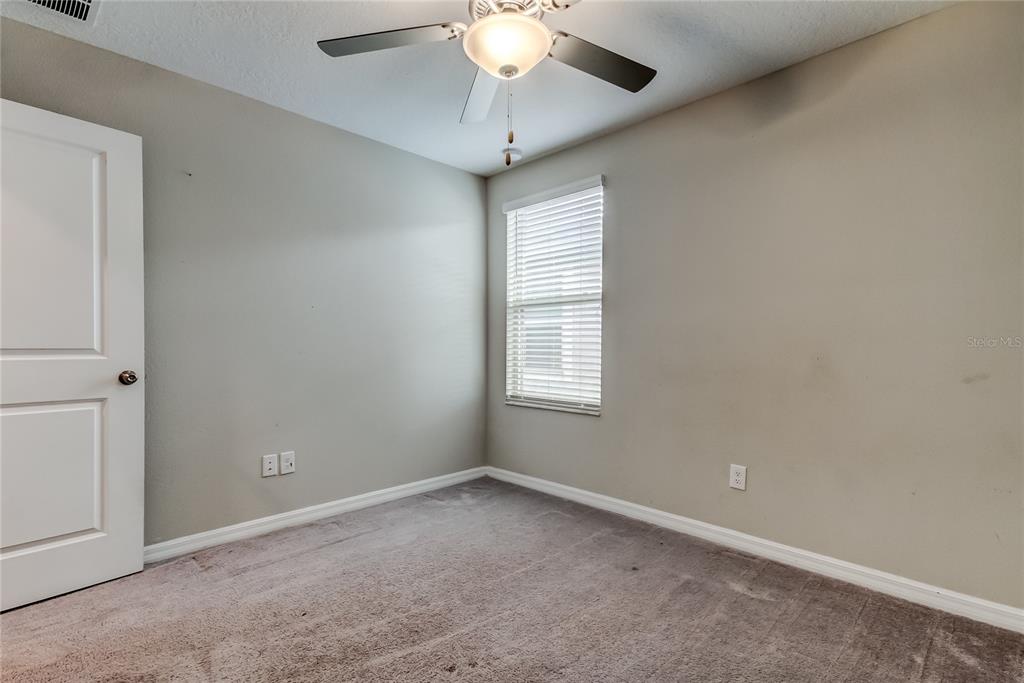 31592 Barrel Wave Way Wesley Chapel, FL 33545 - Photo 47 of 62 a view of an empty room with a window