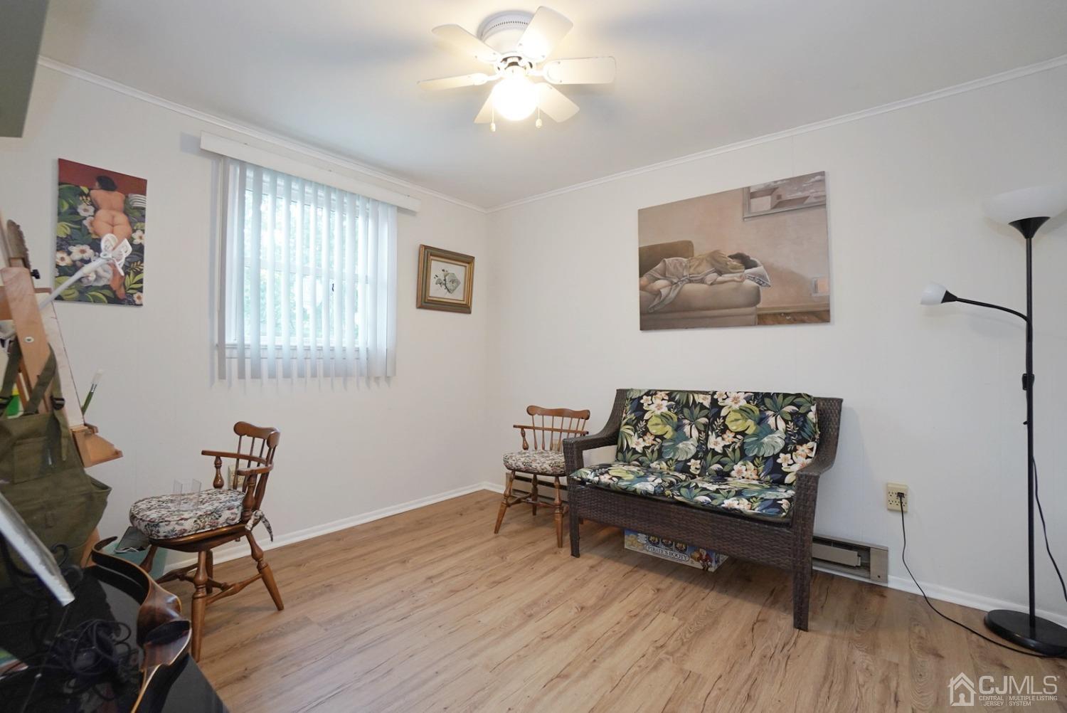 60 Annette Drive Edison, NJ 08820 - Photo 12 of 69 a living room with furniture and a wooden floor