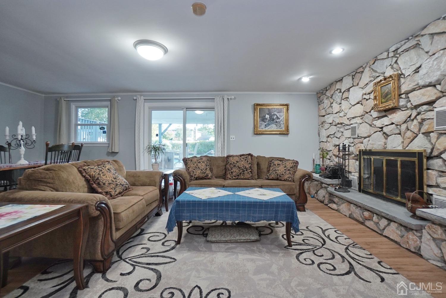 60 Annette Drive Edison, NJ 08820 - Photo 16 of 69 a living room with furniture and a fireplace