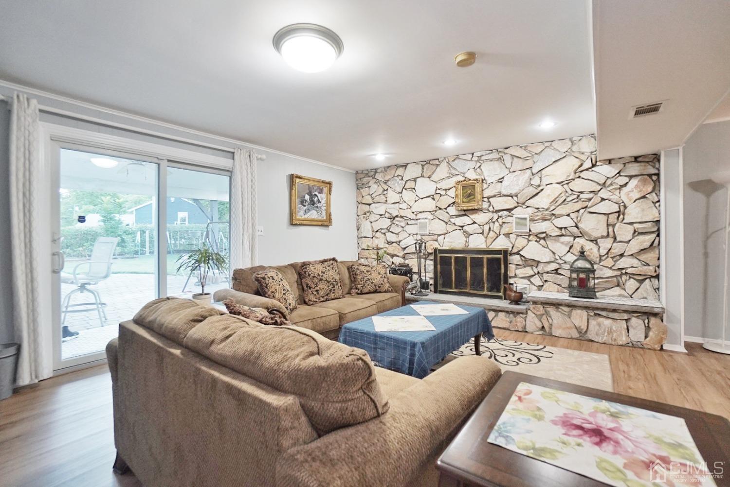 60 Annette Drive Edison, NJ 08820 - Photo 17 of 69 a living room with fireplace furniture and a wooden floor