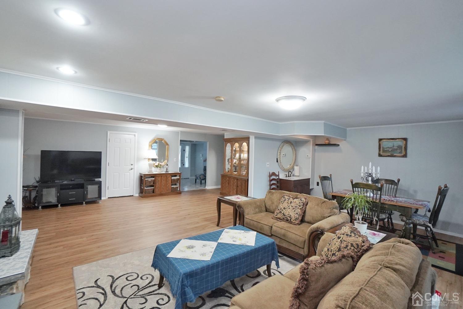 60 Annette Drive Edison, NJ 08820 - Photo 18 of 69 a living room with furniture and a flat screen tv