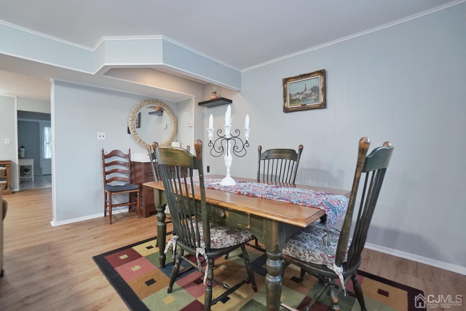 60 Annette Drive Edison, NJ 08820 - Photo 19 of 69 a view of a dining room with furniture and wooden floor